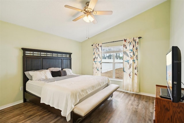 bedroom with dark hardwood / wood-style floors, ceiling fan, and lofted ceiling