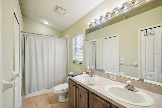 full bathroom featuring tile patterned flooring, a textured ceiling, vaulted ceiling, toilet, and vanity