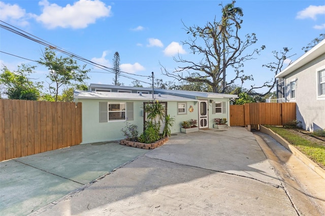 back of house with a patio