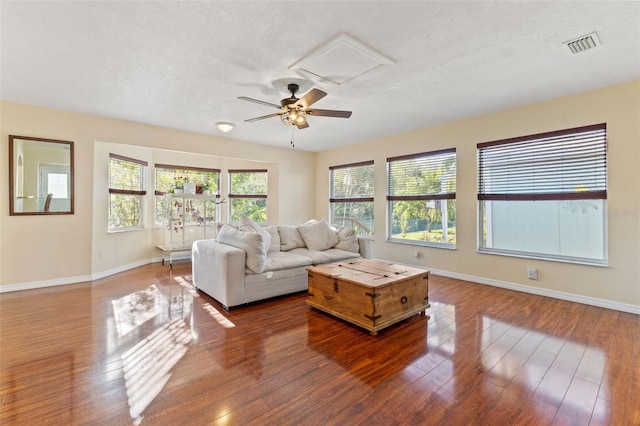 living room featuring hardwood / wood-style floors and a textured ceiling