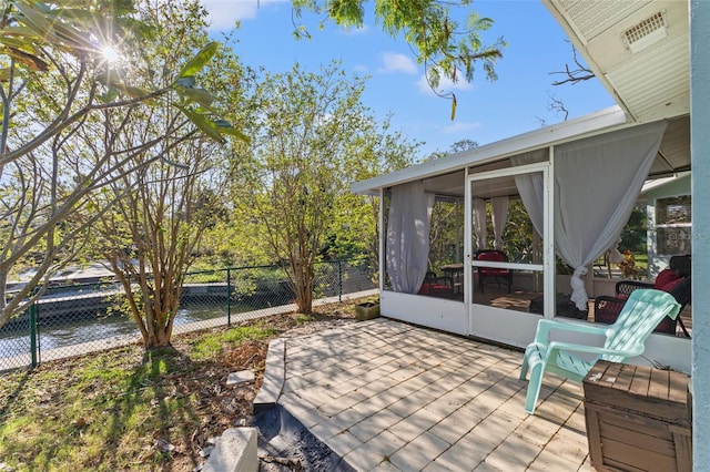 view of patio / terrace with a sunroom