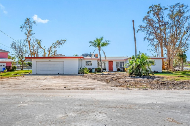 single story home with a garage