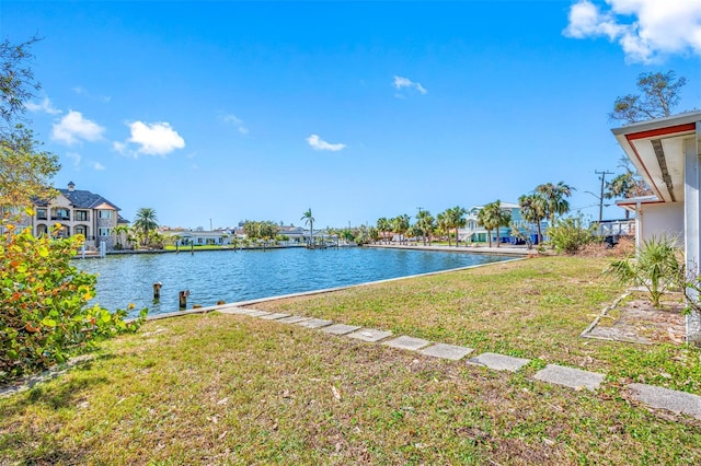 5412 Pali Way, St Pete Beach, FL 33706 - view of green lawn featuring a residential view and a water view