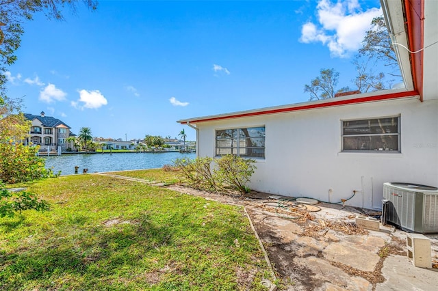 5412 Pali Way, St Pete Beach, FL 33706 - view of green lawn featuring central AC and a water view