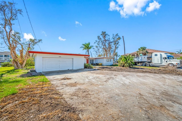 single story home featuring a garage