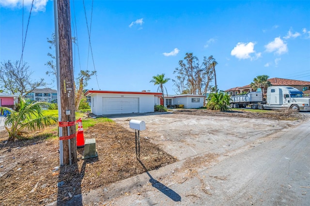 single story home featuring a garage