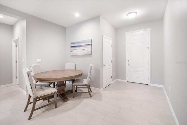 dining space with light tile patterned floors