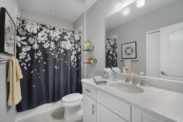 full bathroom featuring vanity, toilet, tile patterned floors, and shower / tub combo