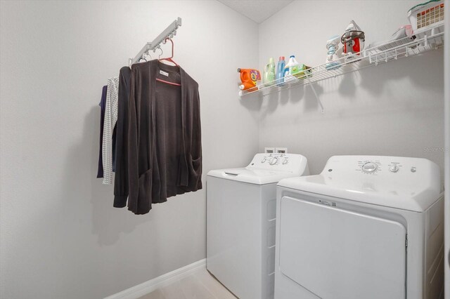 8607 Canyon Creek Trl, Parrish, FL 34219 - washroom featuring separate washer and dryer and baseboards
