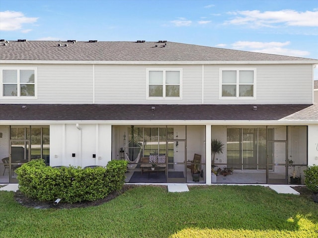 8607 Canyon Creek Trl, Parrish, FL 34219 - rear view of property featuring a shingled roof, board and batten siding, and a lawn