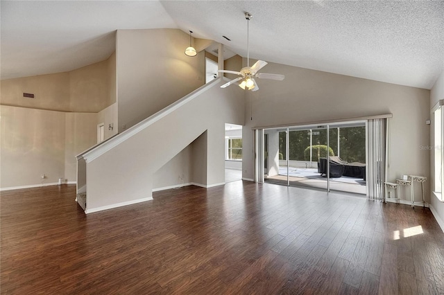 unfurnished living room featuring ceiling fan, high vaulted ceiling, a textured ceiling, and dark hardwood / wood-style flooring