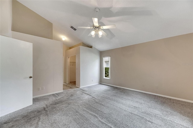 unfurnished room featuring light carpet, high vaulted ceiling, and ceiling fan