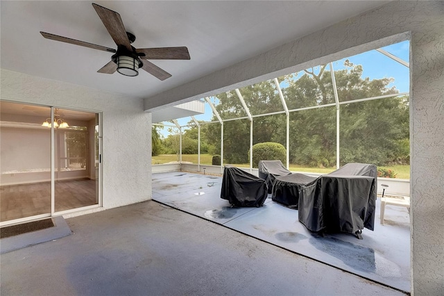 view of patio / terrace with glass enclosure and ceiling fan