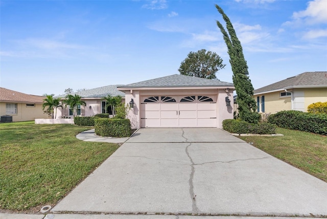 ranch-style house with cooling unit, a front yard, and a garage