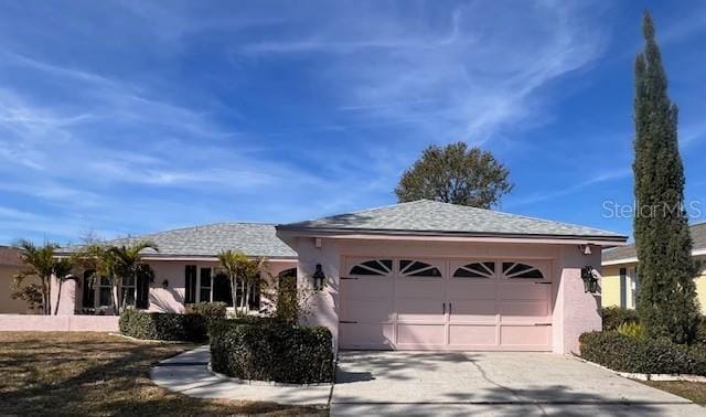 single story home featuring a garage