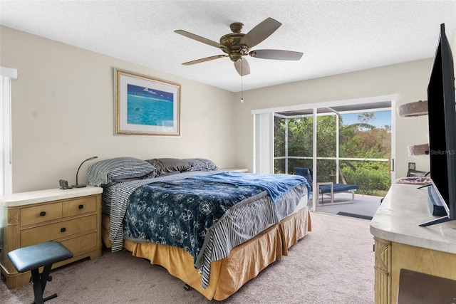 bedroom featuring light carpet, ceiling fan, access to outside, and a textured ceiling