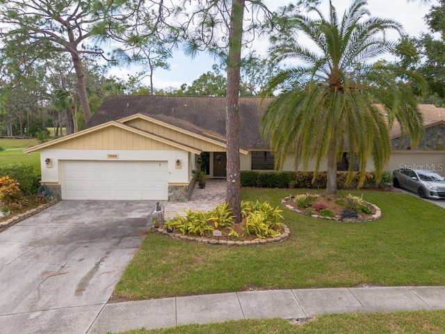 single story home with a front yard and a garage