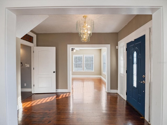 500 53rd St S, Saint Petersburg, FL 33707 - foyer entrance with wood-type flooring, a chandelier, and baseboards