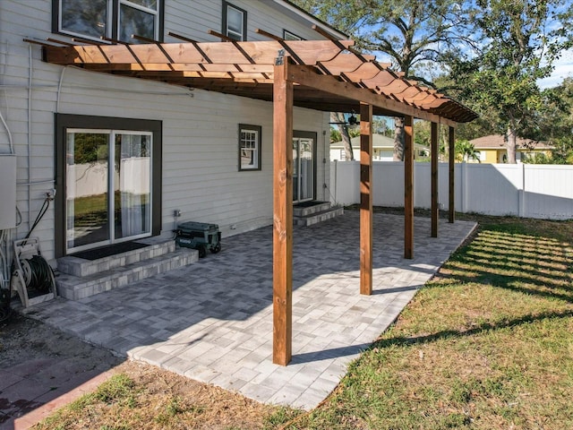 view of patio featuring entry steps, fence, and a pergola