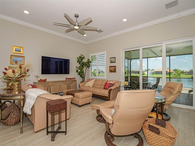 living room featuring ornamental molding, light hardwood / wood-style floors, and ceiling fan