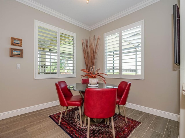 dining area featuring crown molding and dark hardwood / wood-style flooring