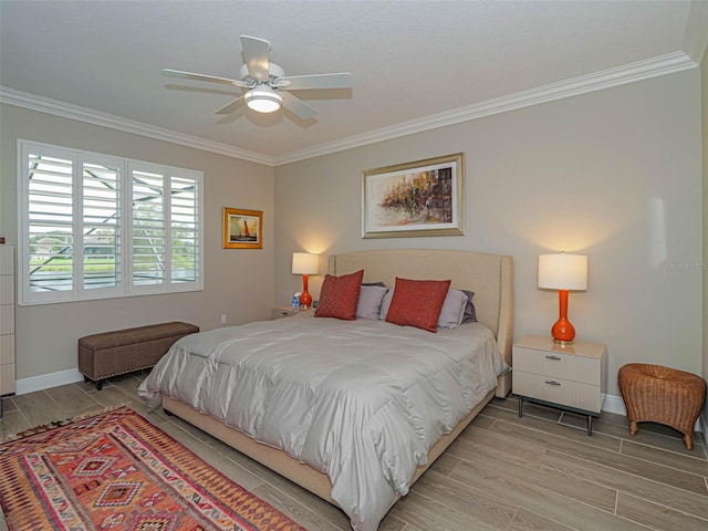 bedroom featuring ornamental molding, hardwood / wood-style floors, and ceiling fan