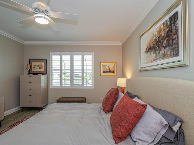 bedroom with ornamental molding, wood-type flooring, and ceiling fan