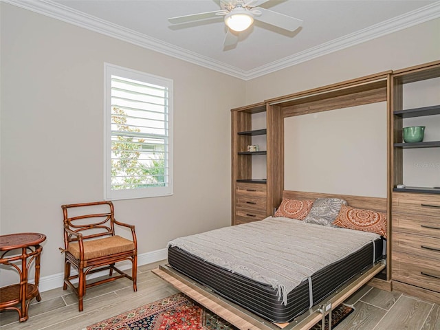 bedroom featuring ornamental molding, hardwood / wood-style flooring, and ceiling fan