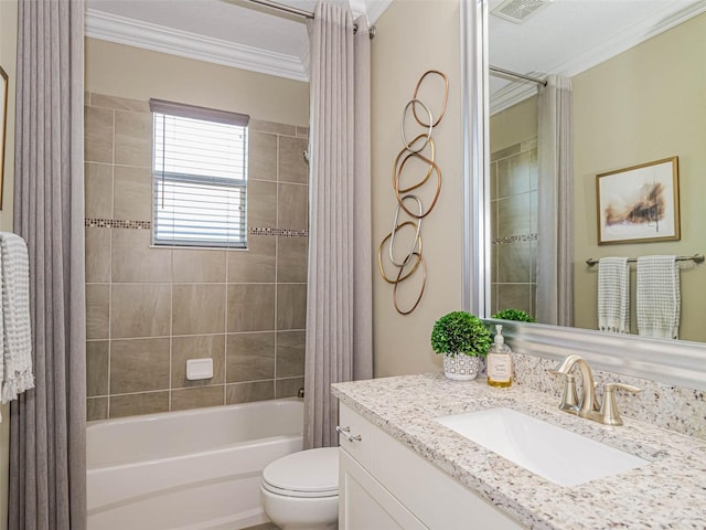 full bathroom with vanity, toilet, ornamental molding, and tiled shower / bath