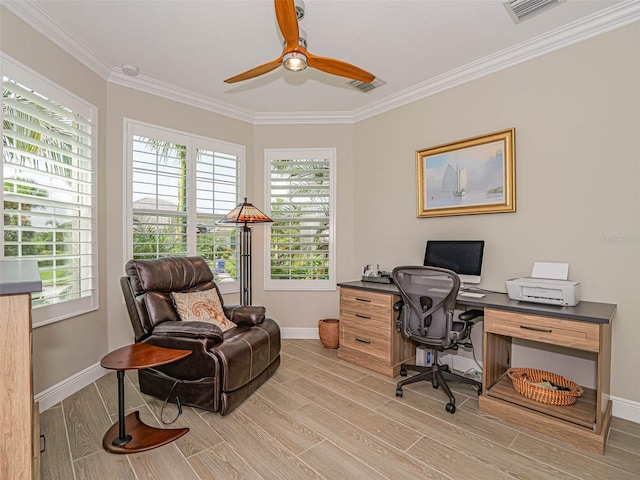 office featuring light hardwood / wood-style floors, a healthy amount of sunlight, ornamental molding, and ceiling fan