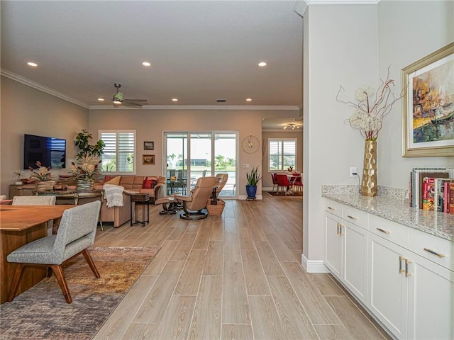 4836 Four Lakes Cir SW, Vero Beach, FL 32968 - living room featuring recessed lighting, light wood-style floors, crown molding, and ceiling fan