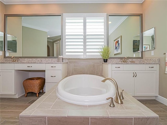 4836 Four Lakes Cir SW, Vero Beach, FL 32968 - bathroom with a bath, a sink, crown molding, wood finished floors, and two vanities