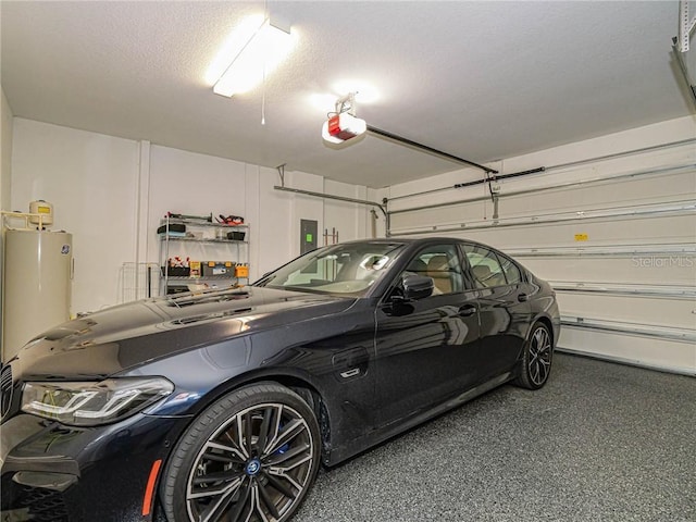 4836 Four Lakes Cir SW, Vero Beach, FL 32968 - garage with electric panel, water heater, and a garage door opener