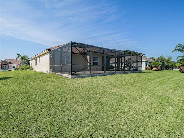 4836 Four Lakes Cir SW, Vero Beach, FL 32968 - rear view of property with stucco siding, a lanai, and a lawn