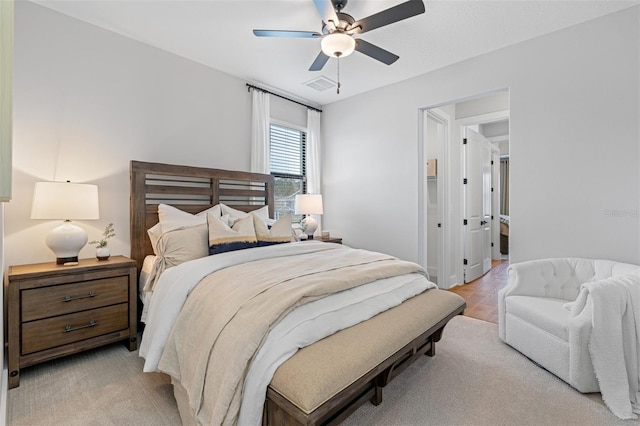 bedroom with light hardwood / wood-style floors and ceiling fan