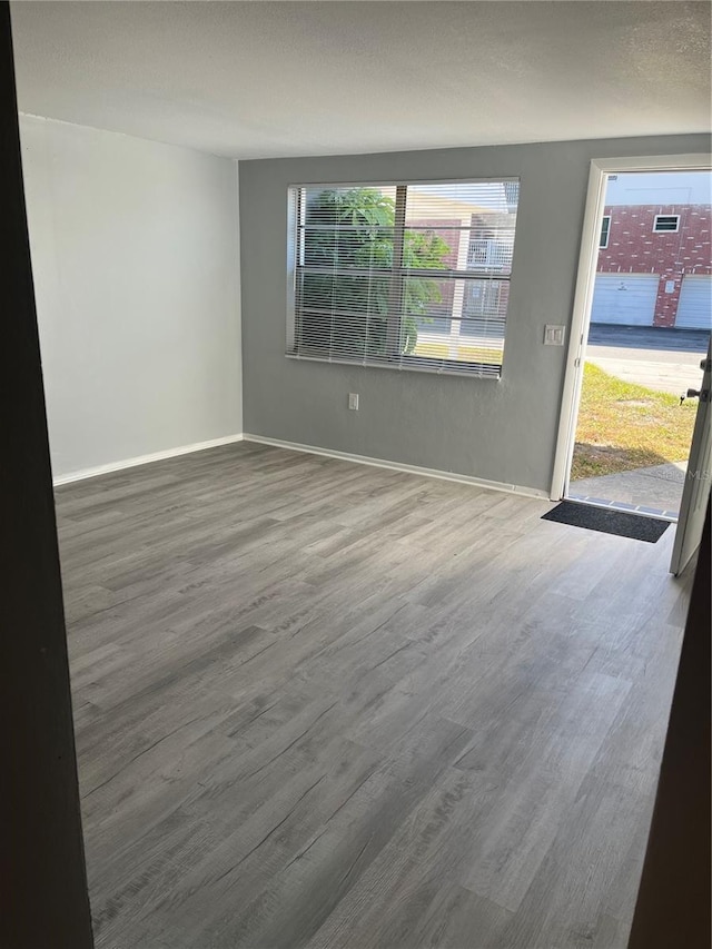 unfurnished room featuring hardwood / wood-style floors