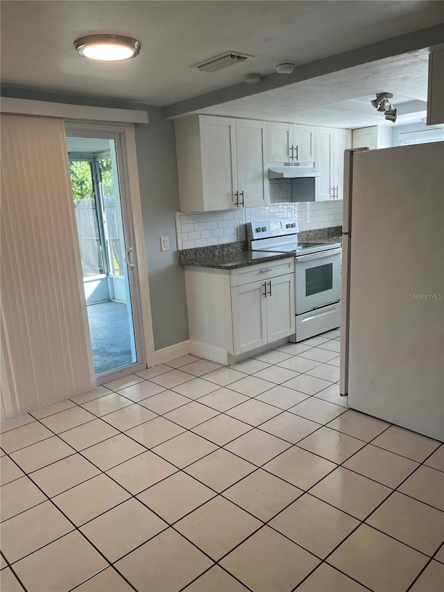 kitchen featuring decorative backsplash, white cabinetry, light tile patterned floors, and white appliances