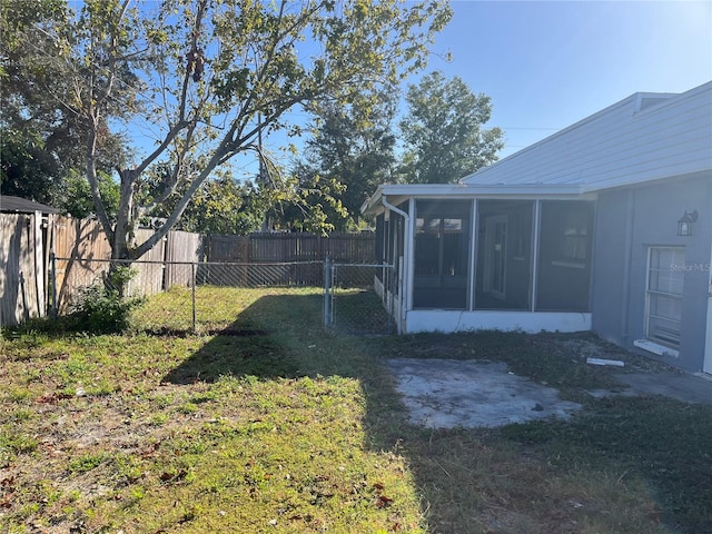 view of yard featuring a sunroom