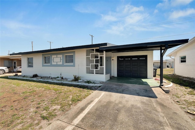 single story home featuring a front yard and a garage