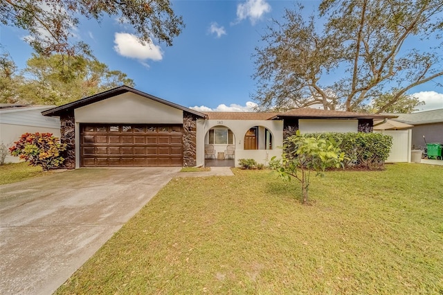 single story home featuring a front lawn and a garage