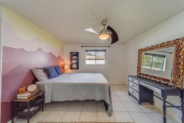 tiled bedroom featuring a textured ceiling and ceiling fan