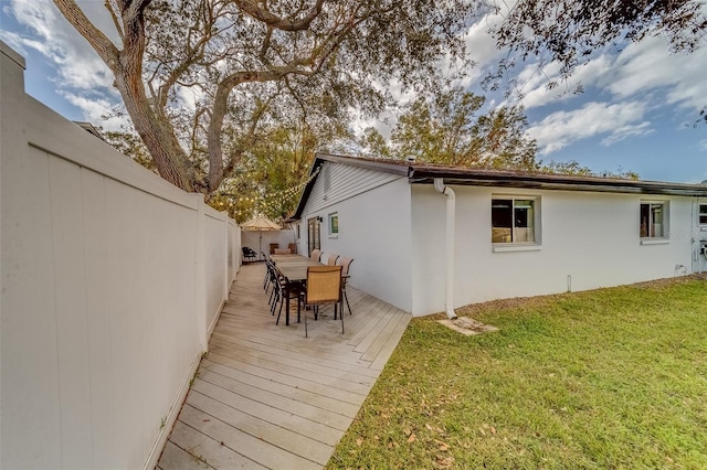 deck featuring a yard