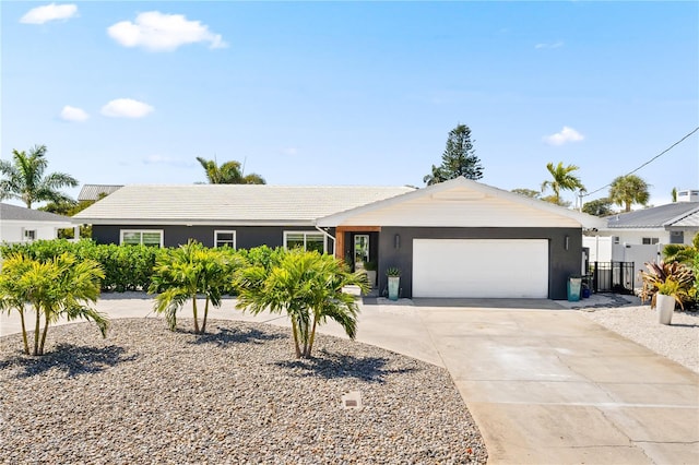 single story home featuring a garage