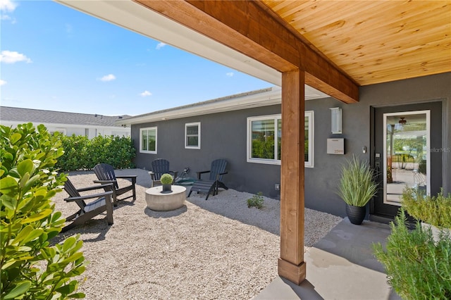 view of patio with a fire pit