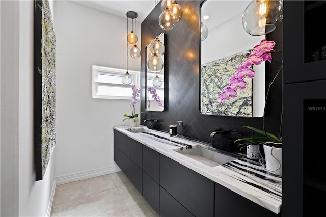 bathroom with vanity, decorative backsplash, and tile patterned floors