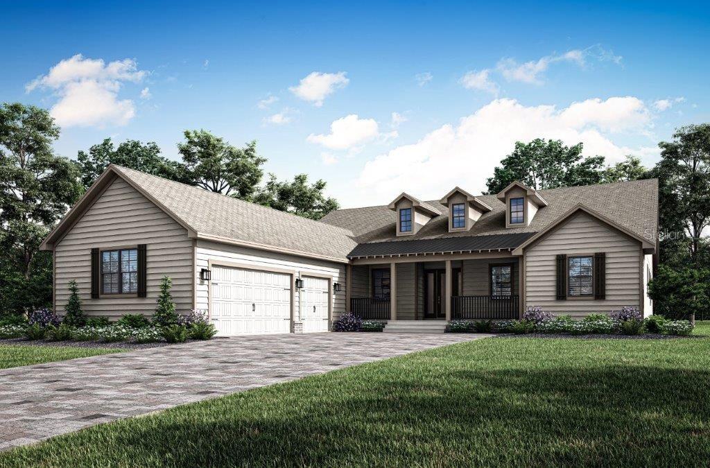 view of front of home featuring a front yard and a garage