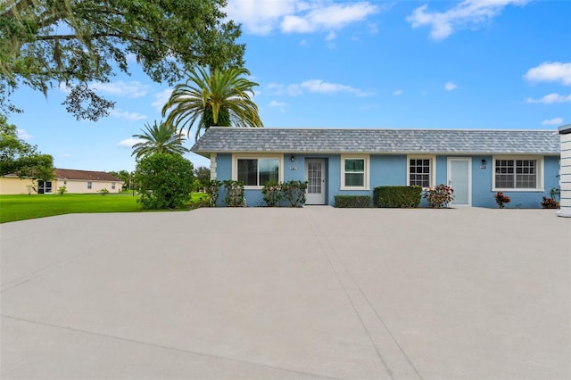 3361 Scorecard Dr Unit 0, New Port Richey, FL 34655 - view of front facade with a front lawn and mansard roof