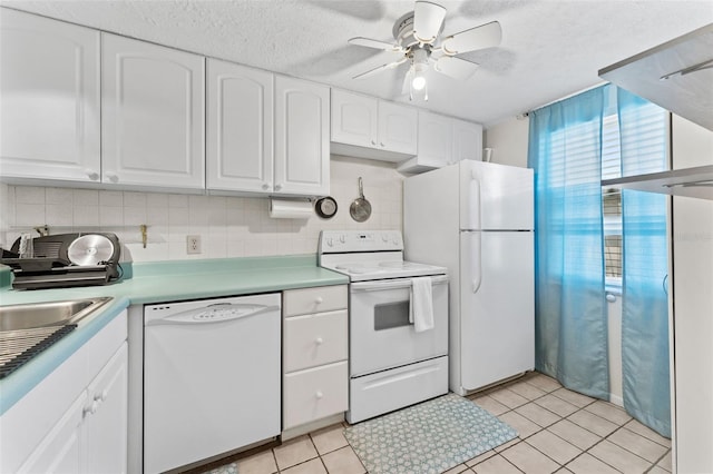 3361 Scorecard Dr Unit 0, New Port Richey, FL 34655 - kitchen with white appliances, ceiling fan, white cabinets, backsplash, and a textured ceiling