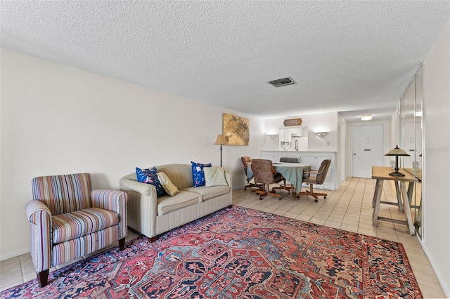 3361 Scorecard Dr Unit 0, New Port Richey, FL 34655 - living room featuring light tile patterned floors and a textured ceiling