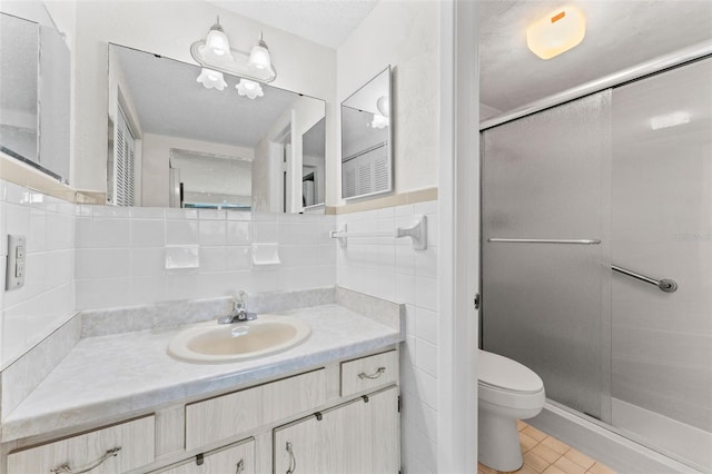 3361 Scorecard Dr Unit 0, New Port Richey, FL 34655 - full bathroom with toilet, vanity, a shower stall, tile patterned floors, and tile walls
